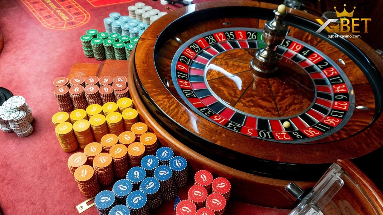 a roulette wheel and different casino chips